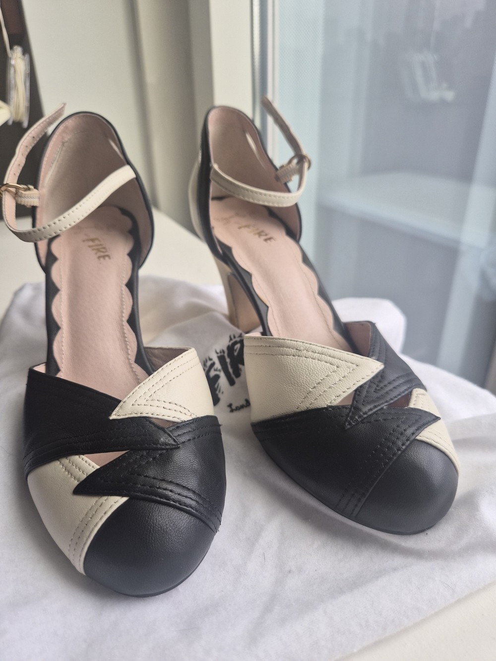 Miss L Fire Two-Tone Black and Cream Women's Ankle-Strap Pumps With Gold Heel
